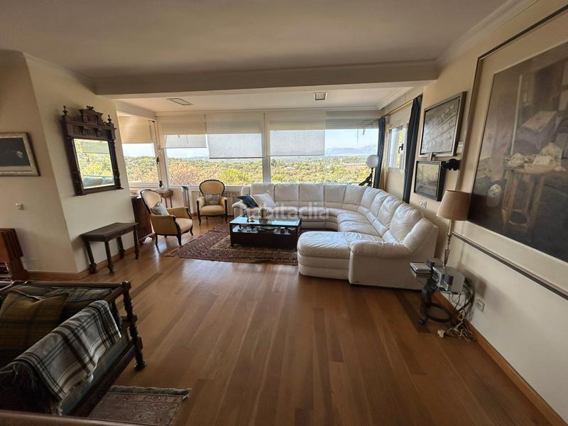 Foto faee7812-fc16-498c-8074-76f6a22f9b98. Chalet with fireplace heating pool in La Berzosilla Torrelodones