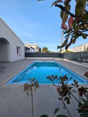 Casa  Carrer badia. Moderna villa en venta con piscina y licencia turística en el ce