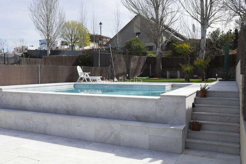 Foto b9e1a9c9-d2f5-4f55-a06d-e469433cf62c. Casa adossada amb calefacció piscina a Quijorna