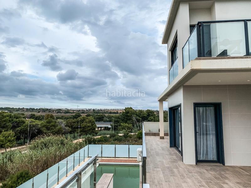 Foto 3c41f4aa-72fb-41e9-b9b1-73a9dd5c2c28. Casa con riscaldamento parcheggio piscina in Campoamor Orihuela