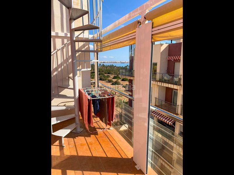 Foto 229b54f1-1858-4b9d-a810-c0dcc134fb0d. Attico con riscaldamento parcheggio piscina in Punta Prima Torrevieja