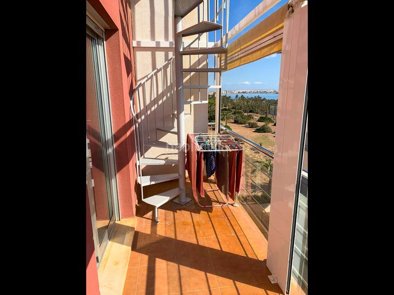 Foto 38c5e127-a61a-4494-b3c2-c15b36fc7e44. Attico con riscaldamento parcheggio piscina in Punta Prima Torrevieja