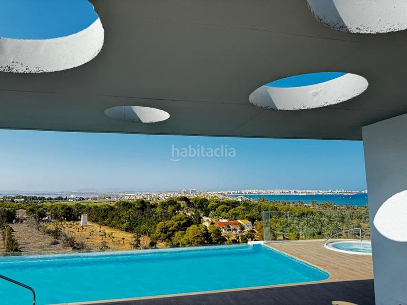 Foto 3f94ed2b-b545-4d78-8c8b-16e79adcfc36. Appartement avec chauffage parking piscine dans Punta Prima Torrevieja