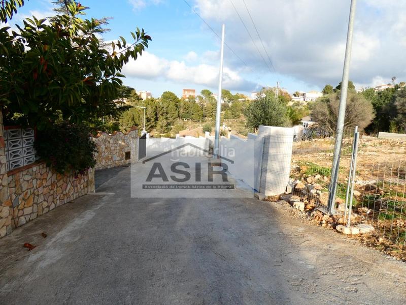 Foto 1acc4ce0-d00a-4360-839d-cb940fa403c1. Terreno residencial sin ninguna comisión!! excelente parcela chaflán con proyecto para construir con luz y agua en la urbanización el respirall en Alzira