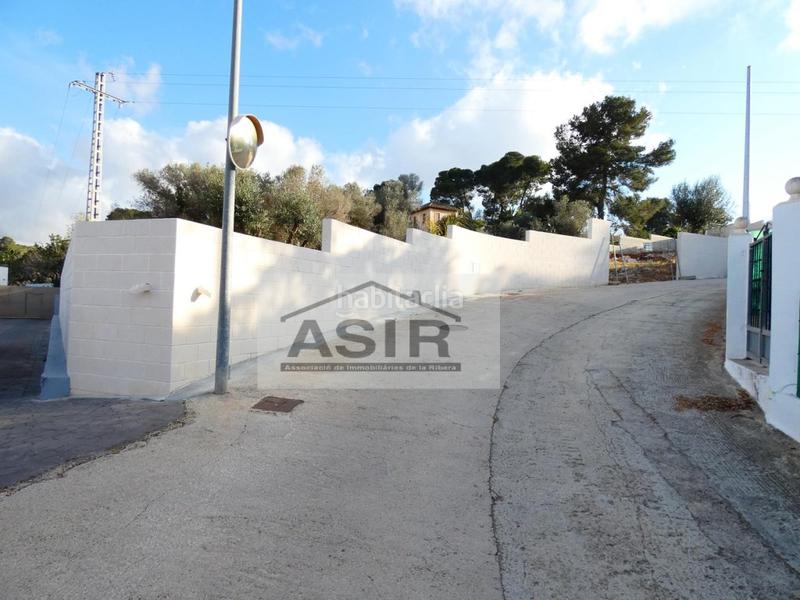 Foto e43948d6-6c32-46e2-858a-261d10e01bd6. Terreno residencial sin ninguna comisión!! excelente parcela chaflán con proyecto para construir con luz y agua en la urbanización el respirall en Alzira
