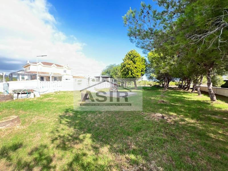 Foto 13b14a5d-d775-43e9-a945-e1871dc27941. Chalet avec parking piscine dans El Marenyet Cullera