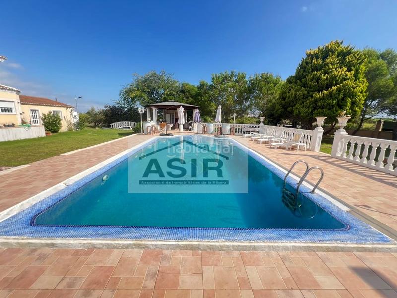 Foto 3da17743-b32c-47e3-a9d2-56b41cbd5ef1. Chalet avec parking piscine dans El Marenyet Cullera