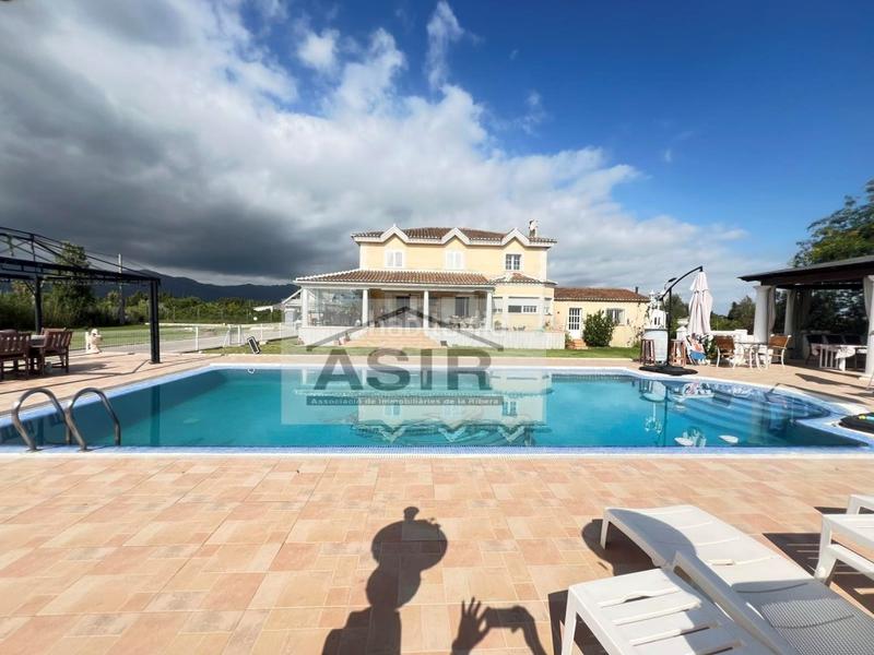 Foto 8d4cdcd6-676e-43d5-8261-562c2ea2aa1f. Chalet avec parking piscine dans El Marenyet Cullera