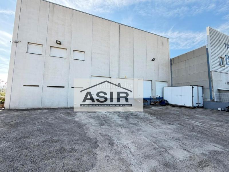 Foto a6961239-2a8d-40a1-95dc-196483774c86. Fabrikhalle in Pobla Llarga (la)