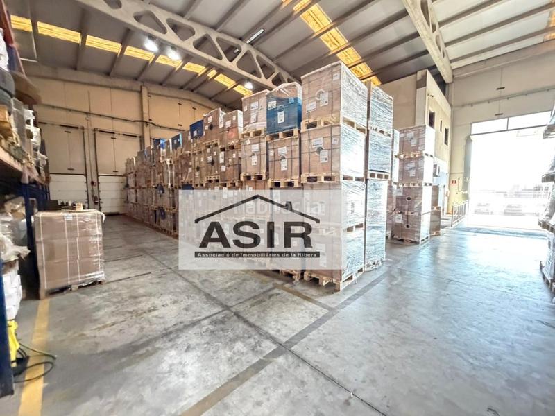 Foto d0b4c226-1724-41f0-bc48-d577ed9085d9. Fabrikhalle in Pobla Llarga (la)