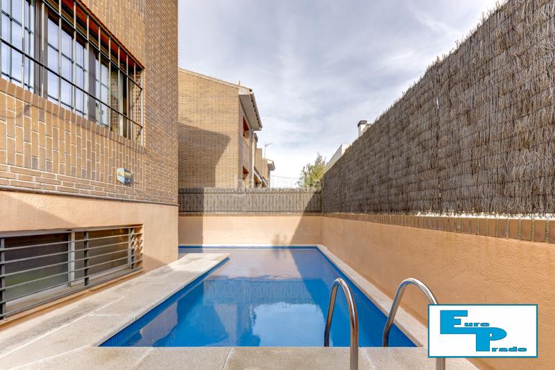 Foto bae96440-2152-46f2-9733-de3f1aeec815. Casa aparellada amb xemeneia calefacció aparcament piscina a Rozas de Madrid (Las)