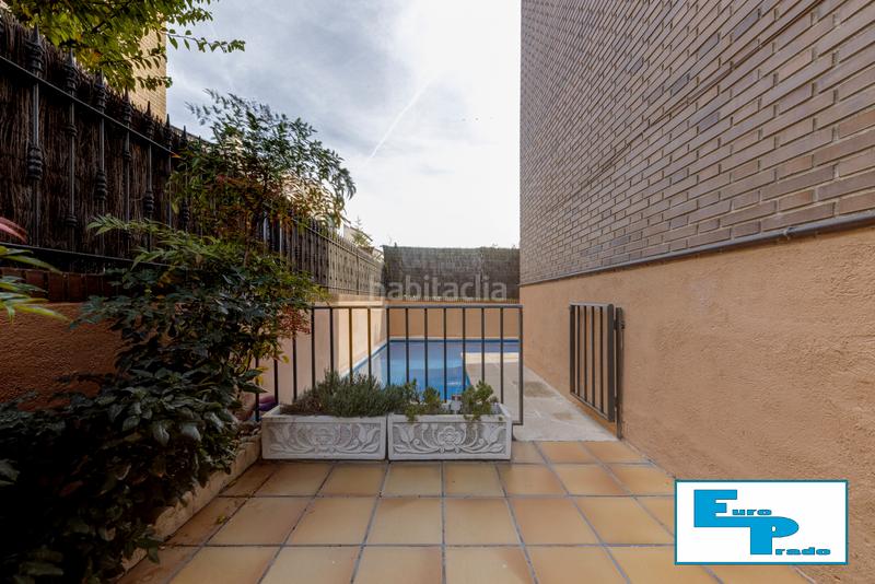 Foto f2bcc9a8-2ac0-4479-95d9-1f06bf97ff90. Casa aparellada amb xemeneia calefacció aparcament piscina a Rozas de Madrid (Las)