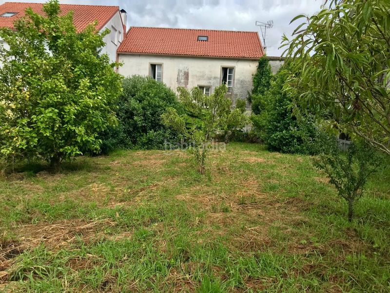 Foto b16a78f9-6bce-436d-a68d-ca3b8f133896. Casa aparellada amb aparcament a Outes