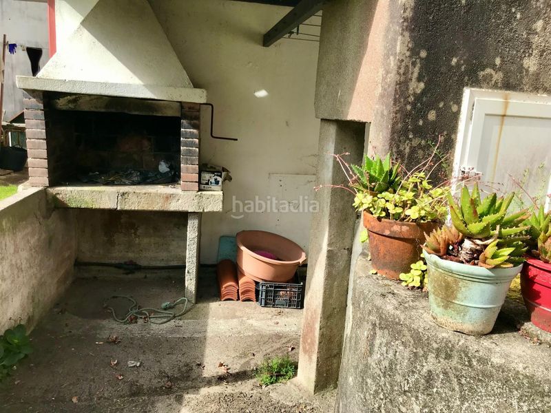 Foto b2ef8305-b990-441c-bdac-eeb53872d2cc. Casa aparellada amb aparcament a Outes