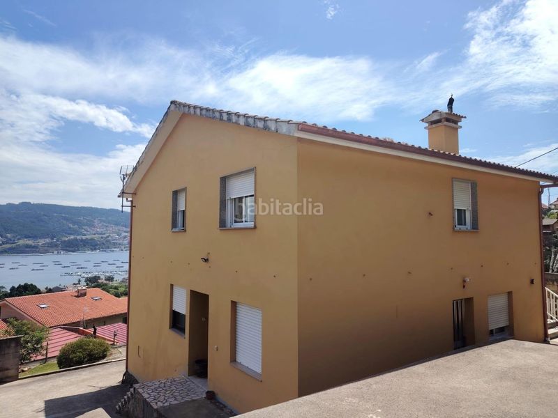 Foto 7a7f43ce-ad35-4dc6-af74-a3515bed04cd. Casa amb calefacció aparcament a Moaña