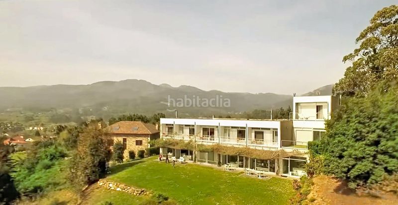 Foto cb4a44fe-ac7a-4ef8-a01c-5621a4939e14. Edifici a Cariño
