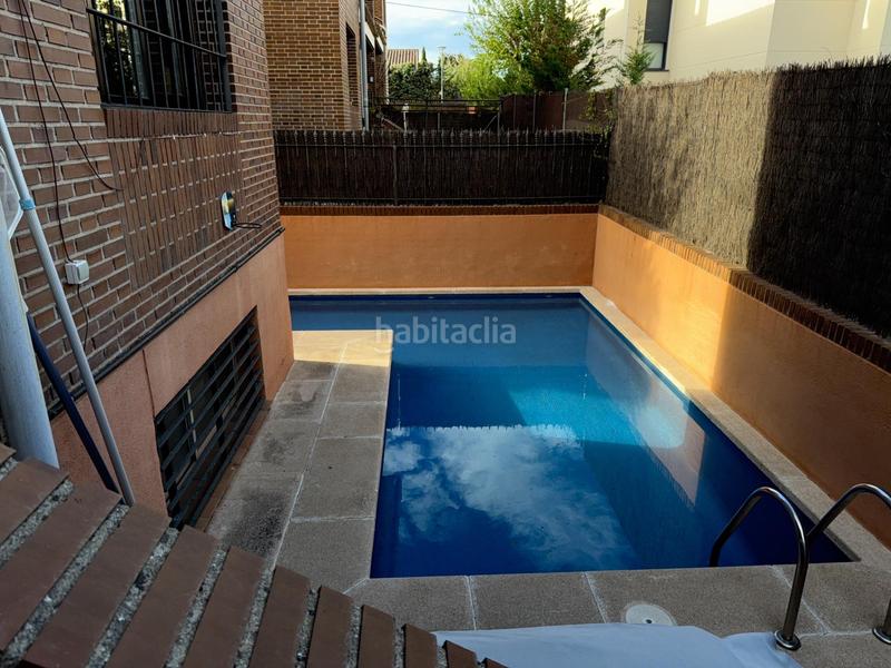 Foto 8264490b-4f1b-4289-8eb0-91a448847eda. Casa aparellada amb calefacció aparcament piscina a Rozas de Madrid (Las)
