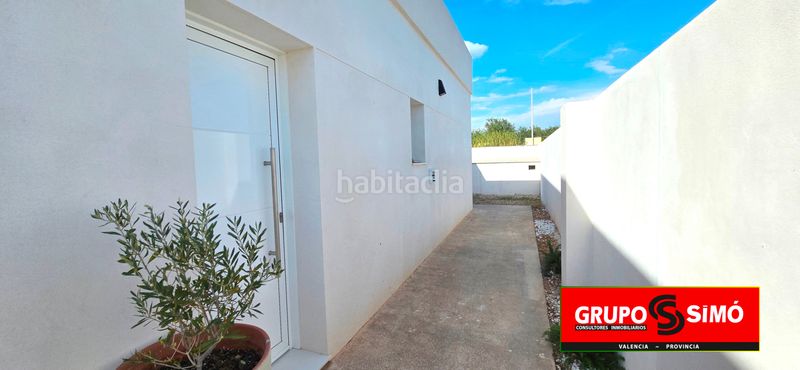 Foto 5a2d415c-ac7c-4d95-a69d-b505f1d8f5d8. Casa adossada amb aparcament piscina a Benissanó