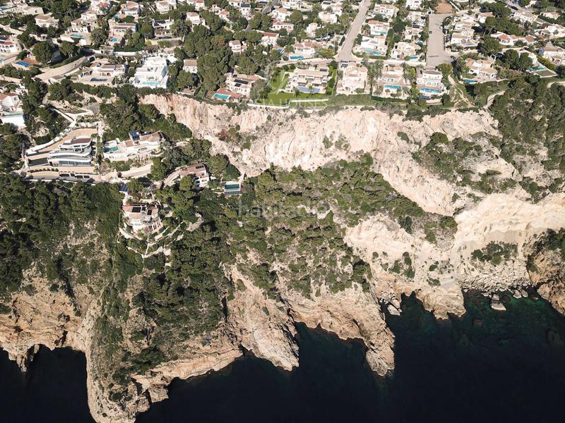 Foto 9f2587ef-2bfe-4881-bd21-694a035ca5b2. Chalet villa athenea una joya arquitectónica en 1a linea de mar sobre acantilado en javea xabia en Xàbia