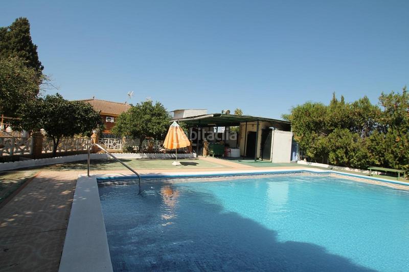 Foto 2bbe79e8-2591-4eb6-b79d-d70cfafdf704. Chalet con riscaldamento parcheggio piscina in Oromana Alcalá de Guadaira