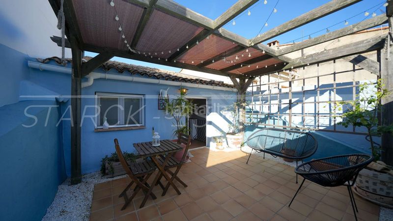 Foto eb99eef7-2f98-4290-bc60-6d03e1ac85bf. Casa adossada amb xemeneia a Benidoleig