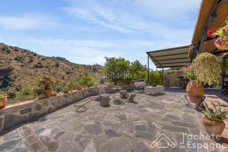 Foto f87629c2-ef26-4b42-a5d3-60770d6a4459. Casa con parcheggio in Canillas de Aceituno