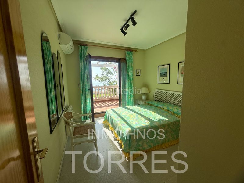 Foto 3b05aff3-ffa4-43a9-8337-99dc0bf2dd91. Casa adossada amb xemeneia aparcament piscina a Papa Luna - Platja del Gurugú Benicarló