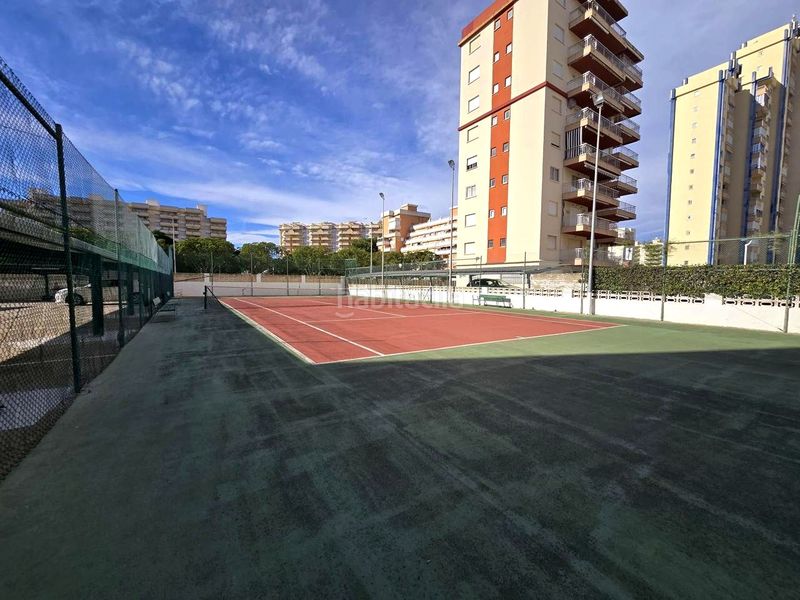 Foto d78d8e3f-52d8-4837-9be5-d74c5b557b28. Apartamento en calle de la devesa 7 atico playa reformado 3 habitaciones, 2 baños, salon , gran terraza, garaje, jardin, piscina y tenis en Gandia