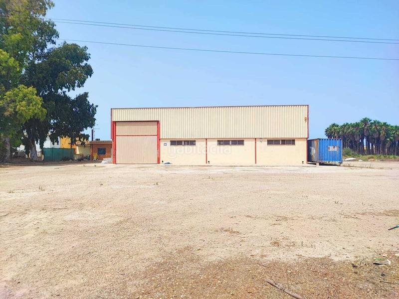 Foto 8e39bd93-13f3-440e-887a-dd5576922479. Nave industrial  situada en el polígono , bien comunicada y con buen acceso desde la carretera principal, con 2 puertas de en Sueca