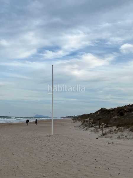 Foto b653fec7-5511-4564-af1e-354b17f2d42f. Casa adossada amb aparcament a Mareny Blau Sueca