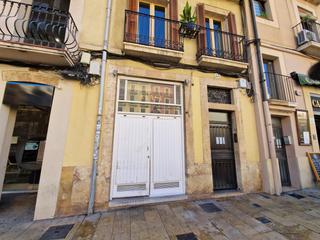 Umzug Geschäftsraum  Plaça de la font. Tienda de pollos al ast en la plaça de la font