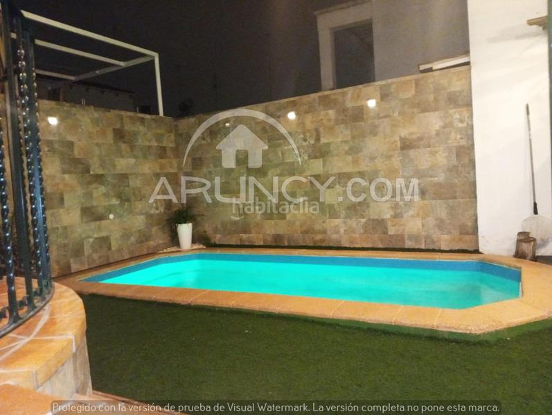 Foto aed5d7e5-a2b6-4d70-b9c7-185876458410. Casa a schiera con riscaldamento parcheggio piscina in Alcalá de Guadaira