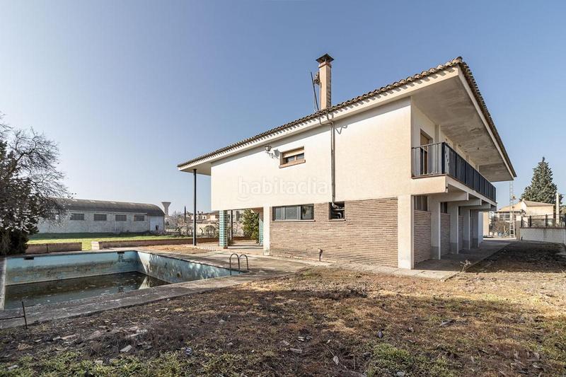 Foto a89d3cf2-20a7-4240-938d-0c0977bf0ffa. Masía casa con terreno y nave en Santa Fe