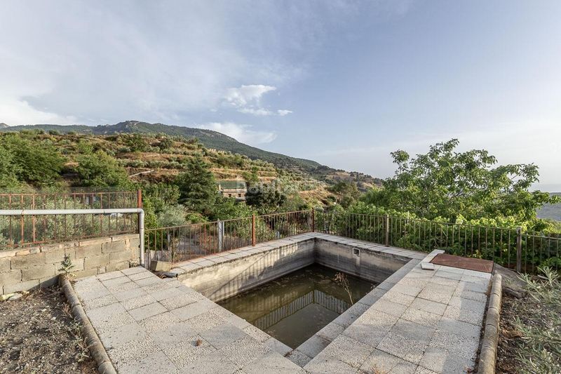 Foto 56322216-5d52-43a1-bbee-c2df194a2b6d. Masia amb piscina a Monachil pueblo Monachil