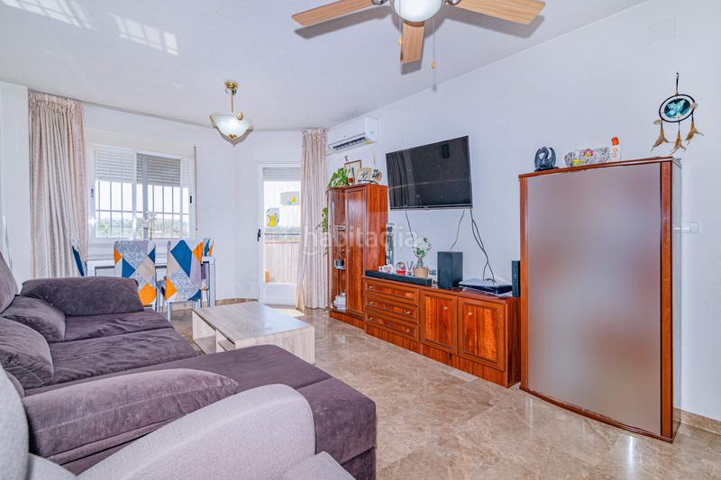 Foto a0d62bd8-7da8-4ef4-b7c0-2ceaec387f23. Piso  en urbanización privada con piscina terraza y vistas despejadas en Zubia (La)