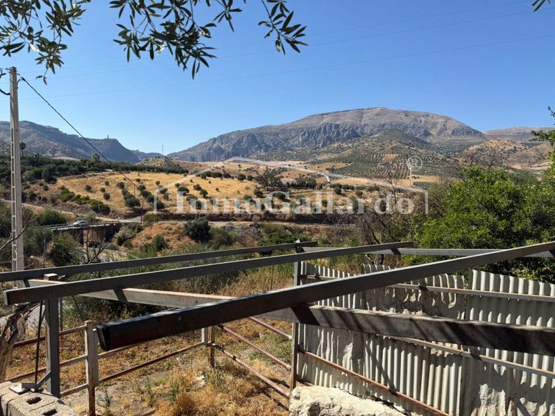 Foto cfcecf39-35cd-49da-bcbb-b7f23613ca15. Casa amb aparcament a Álora
