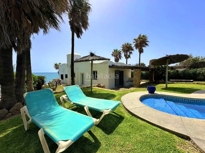 Foto 34fe1516-56b6-42cb-bb51-c520c9104ef8. Casa exclusiva villa en primera línea de playa en Manilva