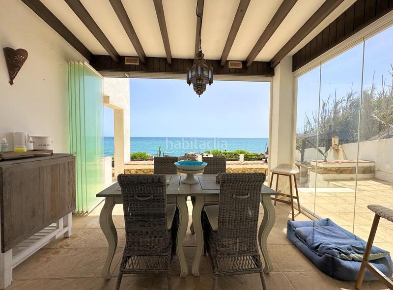 Foto c2137d21-c50a-4fd8-a95e-b074fc120533. Casa exclusiva villa en primera línea de playa en Manilva