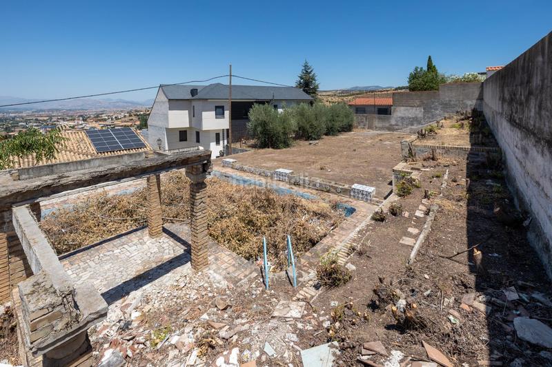 Foto f8a2fce0-a871-4888-bbe4-59fb6a0e3193. Residential plot in Barrio de la Vega Monachil