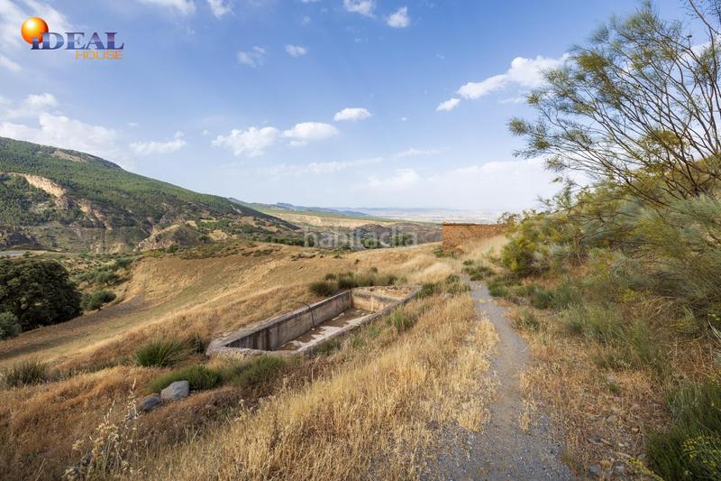 Foto 969745a0-683d-451b-aad1-d9d4a4371ee0. Finca rústica en haza del collado en venta maravilloso paraje natural, a medio camino entre granada y , a veinte minutos en coche, desde cada una de el en Sierra Nevada