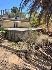 Finca rústica a Montroy. Venta de casitas y balsa en terreno rustico