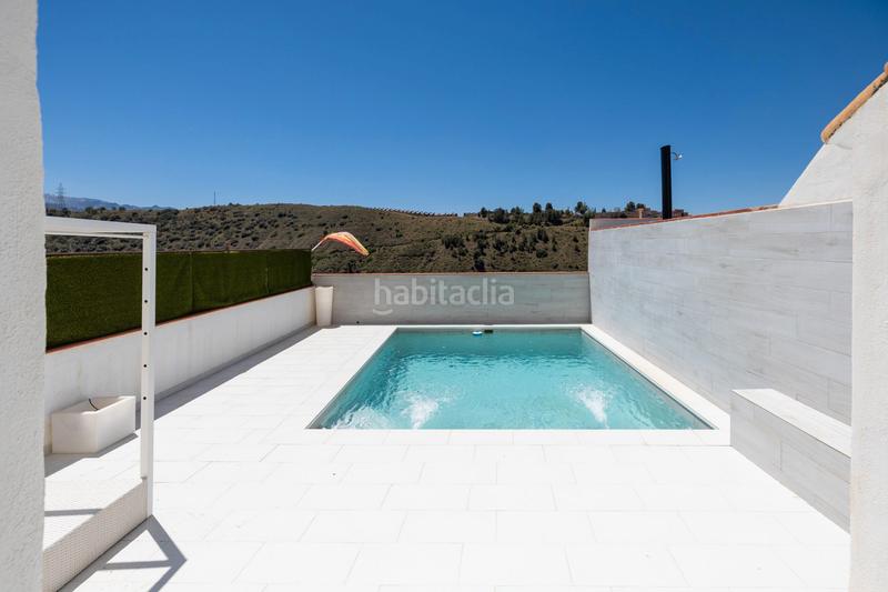 Foto 0528e574-3f84-4238-8d94-742ff6c38f11. Reihenhaus mit kamin heizung parking pool in Crta. De la Sierra Granada