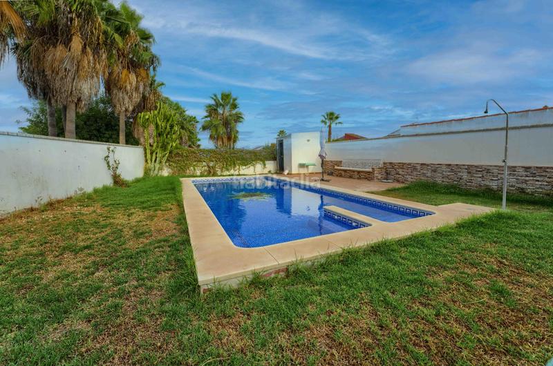 Foto c0b1e25a-a1fd-422d-a389-11c8eebaa400. Casa bifamiliare con parcheggio piscina in Loreto Espartinas