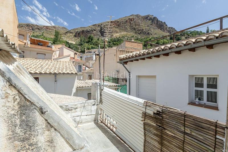 Foto b05e0232-d851-465b-a418-cdd9a839579e. Casa aparellada a Güéjar Sierra