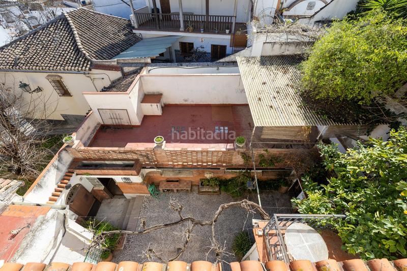 Foto 10521e48-13b8-43a3-8d0a-21587cdac326. Casa adosada casa con encanto a reformar en plena cuesta del chapiz. patio, varias terrazas y mucho más en Granada