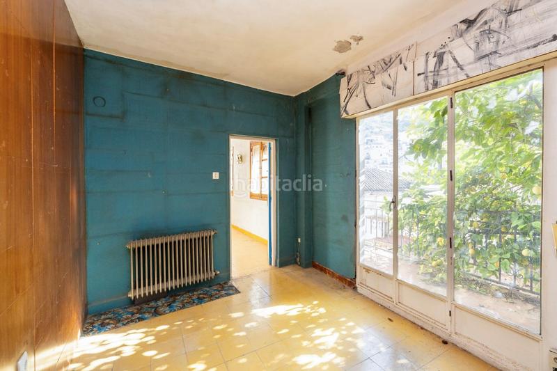 Foto e721f373-fa85-49af-9827-adf77f62b452. Casa adosada casa con encanto a reformar en plena cuesta del chapiz. patio, varias terrazas y mucho más en Granada