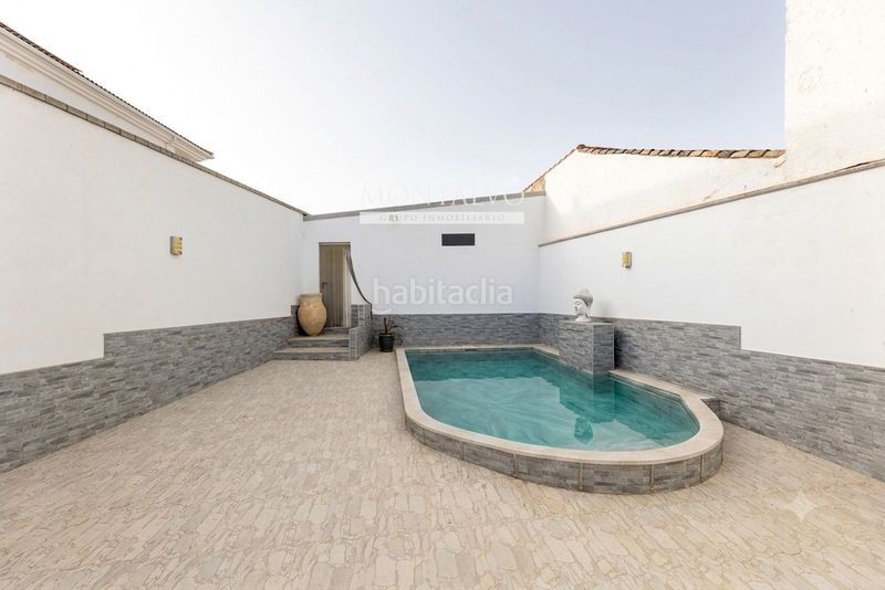 Foto b6ace9dc-ec54-4376-bcd7-f5d0ac6eb060. Casa en de illora (nue) 69 oasis en casanueva planta baja con piscina en Pinos Puente