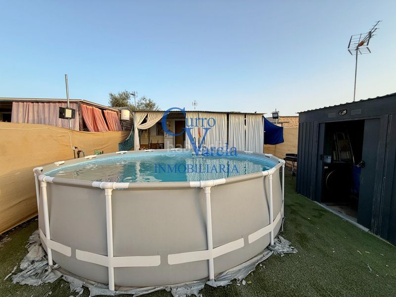 Foto 99c595f3-b5e9-4aa2-90c2-c278f3c43e90. Masia amb calefacció aparcament piscina a La Hacienda - Nueva Andalucía Dos Hermanas