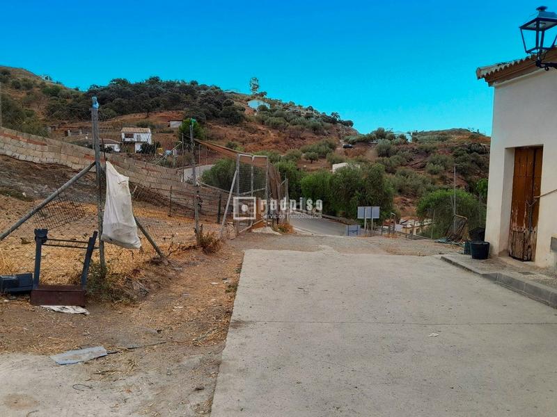 Foto 5649fb2c-0778-43bc-866b-6ef24232942a. Terreno residencial solar urbano , málaga ideal para construir tu hogar soñado a solo 40 minutos de la capital en Riogordo