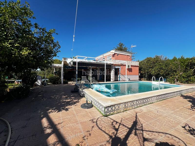 Foto 26f376c2-ca9c-429a-bd54-a4b491e098db. Chalet  con gran parcela, piscina, cocina exterior y garaje. tranquilidad y confort. en Espartinas